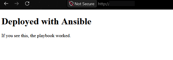 Browser window showing a plain page with the heading &ldquo;Deployed with Ansible&rdquo; and the text &ldquo;If you see this, the playbook worked.&rdquo;